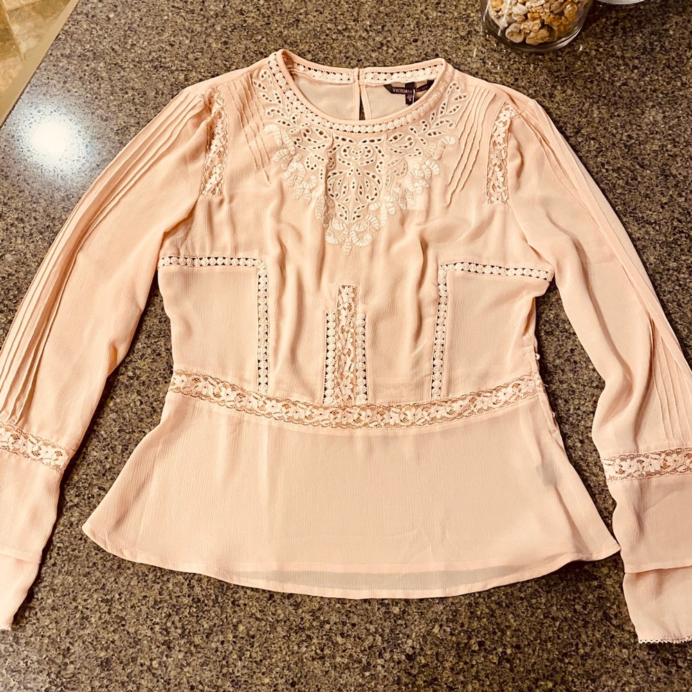 Beautifully detailed sheer blouse.
